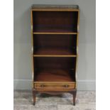 A reproduction mahogany and satinwood banded waterfall bookcase with pierced brass gallery and