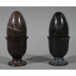 A pair of serpentine stone eggs and egg cups (4)
