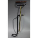 A brass stirrup pump with iron handle and stand early 20th century approximately 71.
