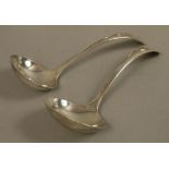 A pair of sauce ladles, engraved with double crest, Sheffield 1915 maker's initial JR and HA,