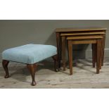 A reproduction square foot stool on mahogany stained beech cabriole legs and pad feet,