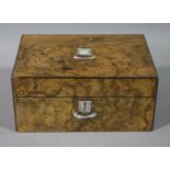 A Victorian burr walnut veneered box the hinged lid with vacant mother of pearl cartouche and