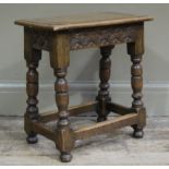 A early 20th century joynt stool of traditional design with carved demi-lunes to the apron,