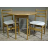 A reproduction oval kitchen table in square tapered legs;