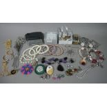 A small collection of silver jewellery including brooches and earrings variously set with amber,