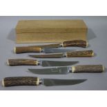 A set of six antler handled stainless steel steak knives by Viners of Sheffield,
