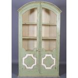 A French pale green and cream painted cabinet of arched profile having two glazed and panelled