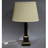 A black and gold painted metal columnar table lamp with oval pleated cream shade