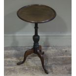 A mahogany tripod wine table