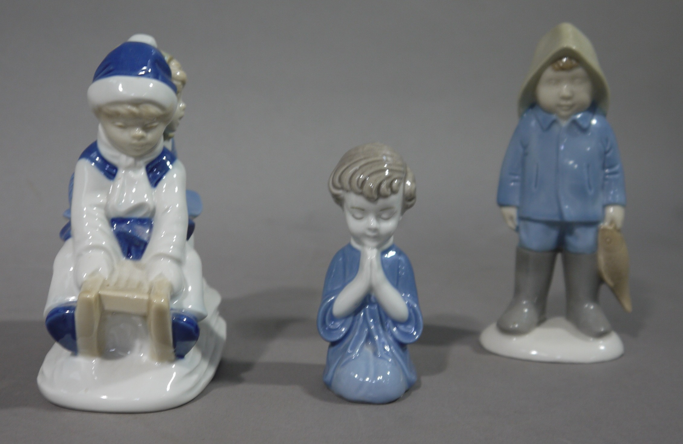 A continental pottery figure of children on a sledge, - Image 2 of 2