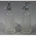 A pair of vintage soda syphons etched with Parker Brothers of Drighlington,