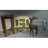 Cast iron model of a stag, 58cm high, a nest of two bow fronted walnut veneered tables,