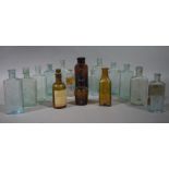 A quantity of moulded clear and coloured glass bottles including 'Boots Cash Chemists',
