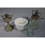 A Victorian pottery jelly mould, a glass churn,