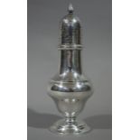 A silver muffineer with flambeau finial baluster body and on circular foot, Chester 1904,