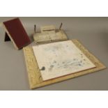 A snakeskin covered desk set comprising rectangular blotter,