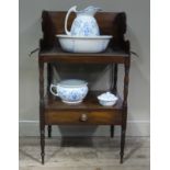 A 19th century mahogany washstand having a high three quarter gallery,