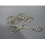 A pair of silver cast grape scissors of grapevine design London 1971 together with a pair of glass