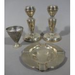 A pair of silver candlesticks on circular weighted bases Birmingham 1967 together with a pair of
