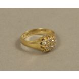 A George V diamond cluster ring in 18ct gold,