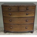 A 19th century mahogany bow front chest of two short and three long graduated drawers with turned