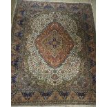 A large carpet square of Persian design having a deep rose pink medallion to the centre on an ivory