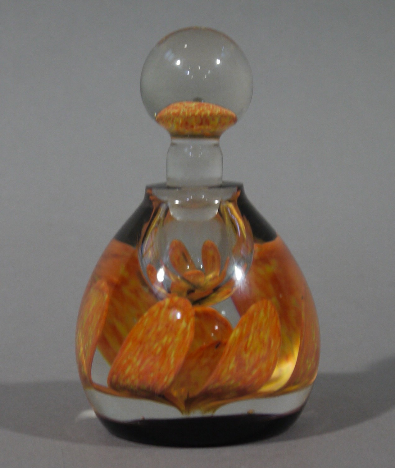 A Caithness glass petal ink bottle, 13cm high,