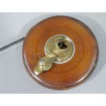 A leather cased tape measure by John Raybone and Sons, 66ft, number 4151,
