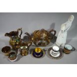 A quantity of Victorian copper lustre pottery, a continental porcelain figure,