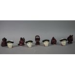 Five reproduction resin moulded netski together with four reproduction character thimbles