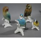 Four continental pottery figures of birds with blue printed mark to underside,