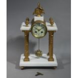A Victorian portico clock with basket and flower finial the drum shaped case enclosing a cream