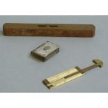 A late 19th/early 20th century brass topped spirit level,