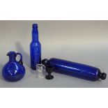 A small quantity of mainly blue glass including a Bristol blue glass Victorian rolling pin,