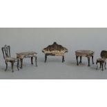 Five items of silver miniature doll's house furniture comprising sofa,