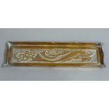 An Arts and Crafts brass tray of rectangular galleried form with pinched corners and sides the