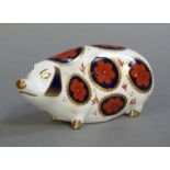 A Royal Crown Derby paperweight modelled as a pig, printed mark in red, ceramic plug, 12.