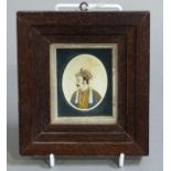 A Persian oval portrait miniature painted with a moustacheod male figure wearing a turban and