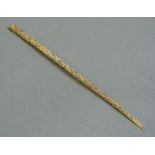 A Japanese ivory parasol handle carved with flowerheads and finches,