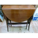 An Edwardian mahogany Sutherland table in Sheraton style with railed ends,