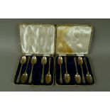 A set of five silver golfing teaspoons, cased,
