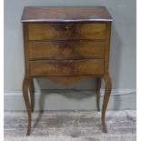 A French style walnut veneered and inlaid three drawer chest on angular cabriole legs