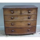 An early Victorian mahogany bow front chest of two short and three long graduated,