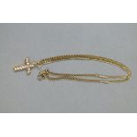 A cross and chain in 9ct gold,