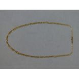 A neckchain of facetted figaro links in 9ct gold, approximate length 45cm,