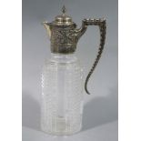 A Victorian silver mounted cut glass claret jug with cartouche engraved with a crest over 'EE
