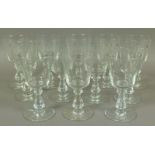 A set of twelve 19th century glass wines, plain bucket bowl on a knopped and faceted stem,