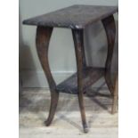 An early 20th century carved occasional table with undertier