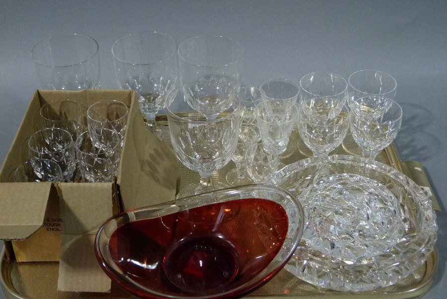 An Art Glass oval bowl of red colour with clear rim, a set of six sherry glasses,