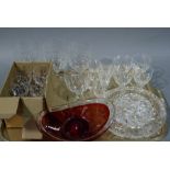 An Art Glass oval bowl of red colour with clear rim, a set of six sherry glasses,